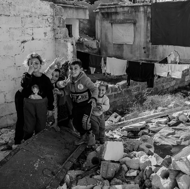 Palestine children among the rubble of a house in Gaza