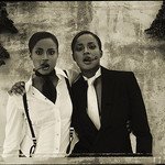 women in suits with cigars