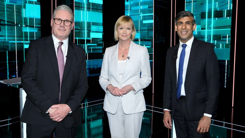 Keir Starmer, Julie Etchingham and Richie Sunac pose for a photo at the 2024 UK general election ITV debate.