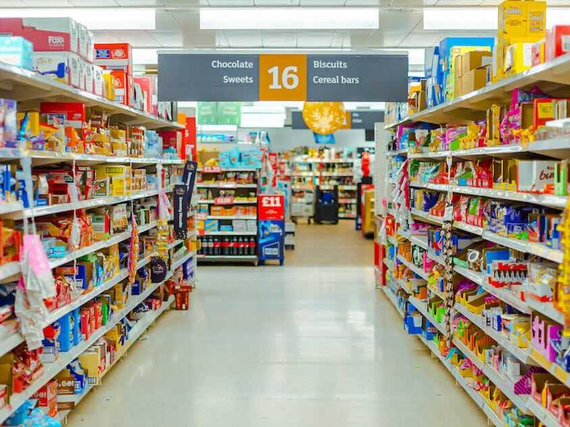 a supermarket aisle filled with lots of food