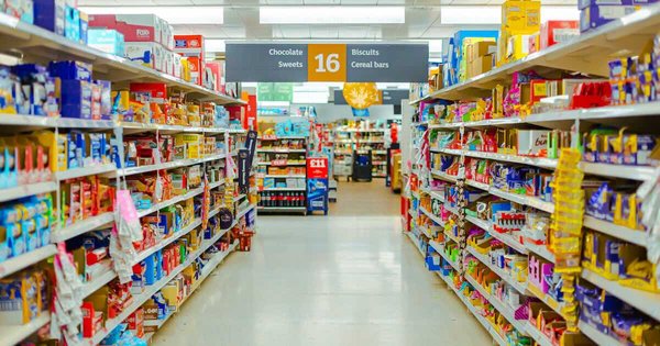 a supermarket aisle filled with lots of food