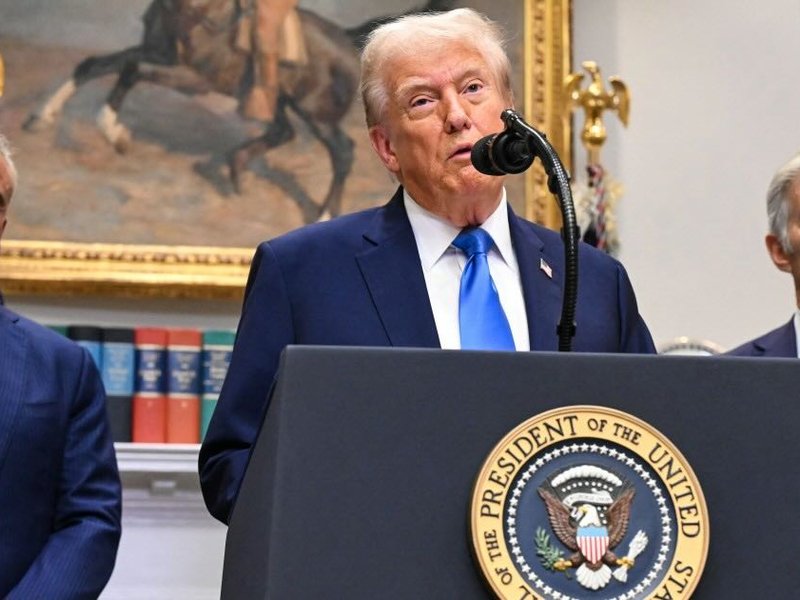 US President Donald Trump (C), alongside Secretary of Health and Human Services Robert F. Kennedy Jr. (L) and Medicare and Medicaid Administrator Mehmet Oz (R), speaks about autism in White House