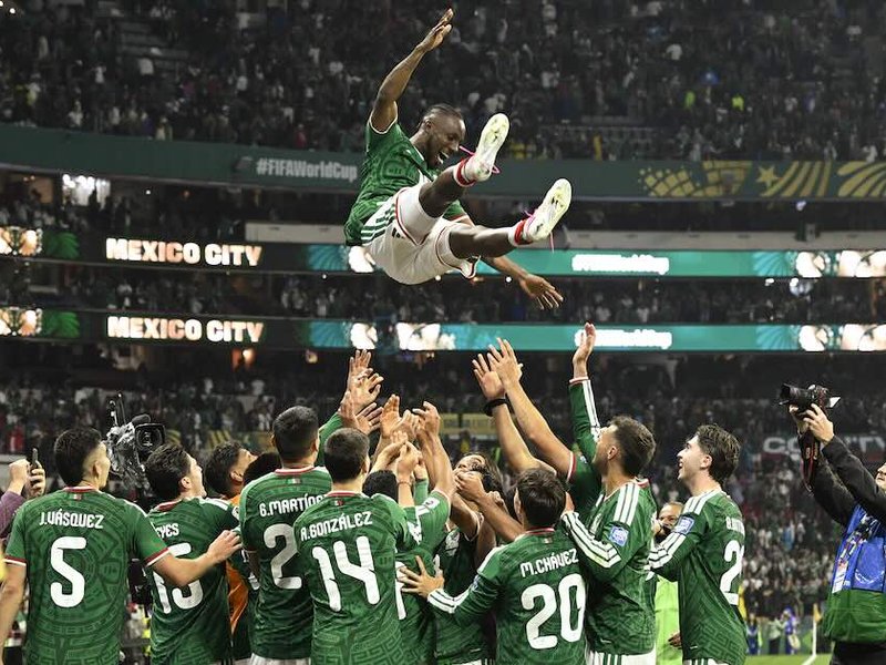 Mexico's players celebrate after winning the 2026 World Cup round of 32 football match between Mexico and Ecuador in Mexico City on 30 June.