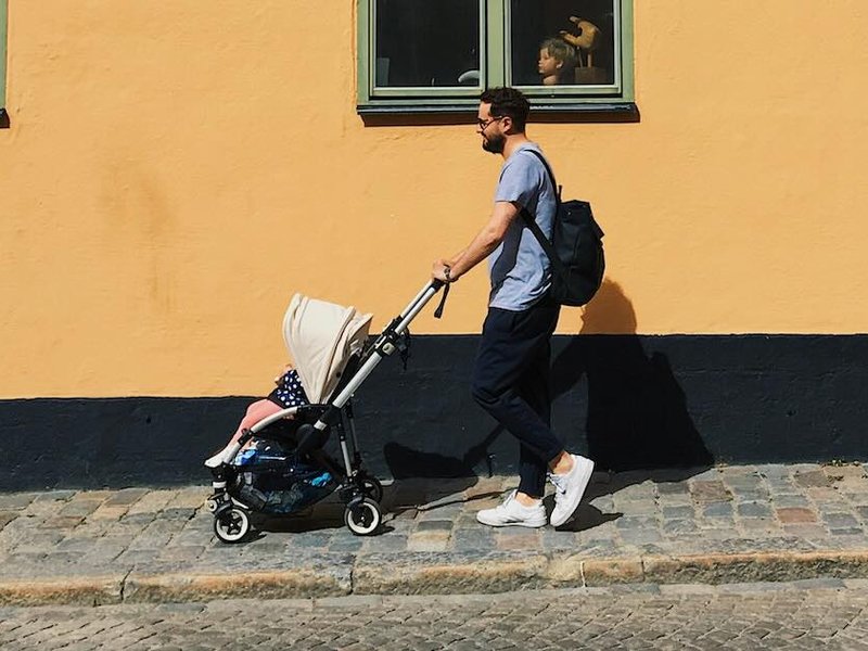 A man pushing a stroller