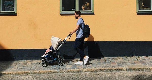 A man pushing a stroller