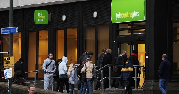 A group of people outside a job centre.