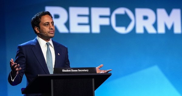 Zia Yusuf on stage during a press conference