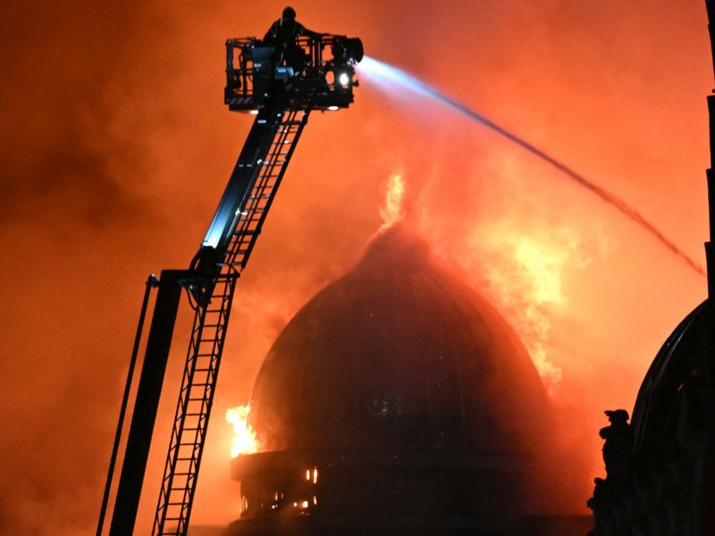 An image of firefighters working to control a large fire in Glasgow city centre on 8 March.