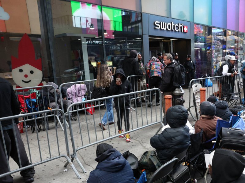 A photo of people camping out in line outside of the Swatch store in Times Square in New York, ahead of the May 16 release of the Audemars Piguet x Swatch Royal Pop watch.