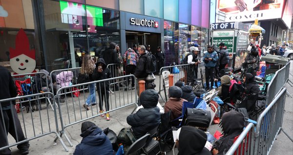 A photo of people camping out in line outside of the Swatch store in Times Square in New York, ahead of the May 16 release of the Audemars Piguet x Swatch Royal Pop watch.