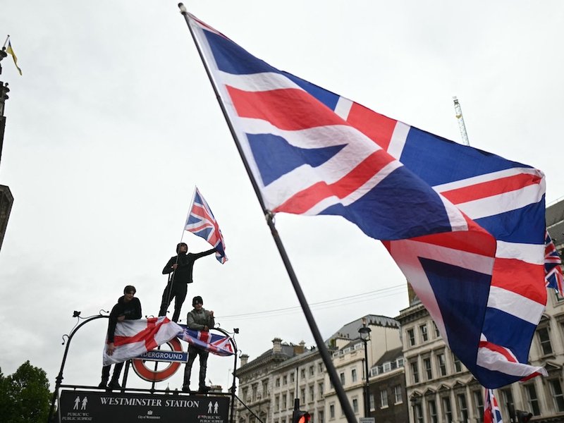 Union Jacks being waved during the May 2026 Unite the Kingdom march