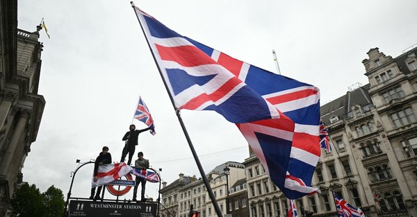 Union Jacks being waved during the May 2026 Unite the Kingdom march