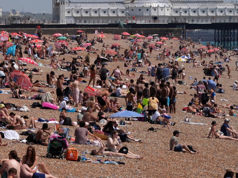 An image of people on the beach in Brighton on 25 June 2026 during a heatwave.