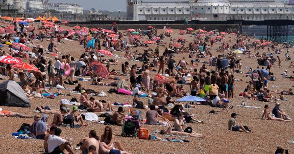 An image of people on the beach in Brighton on 25 June 2026 during a heatwave.