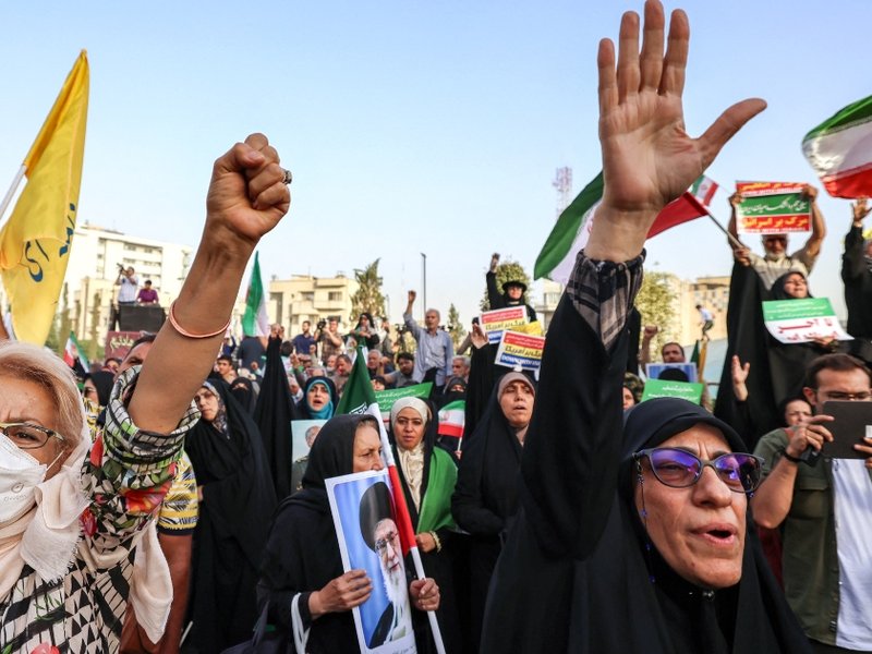 Iranians celebrate a ceasefire between Iran and Israel at Enghlab Square in the capital Tehran on June 24, 2025