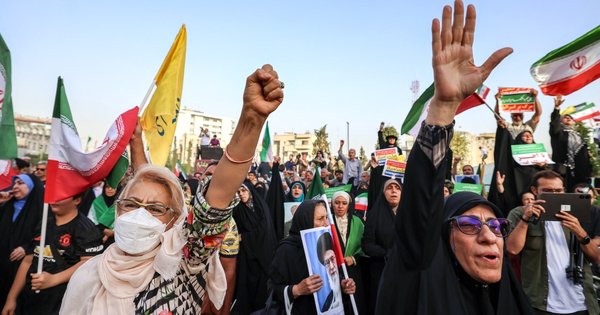Iranians celebrate a ceasefire between Iran and Israel at Enghlab Square in the capital Tehran on June 24, 2025