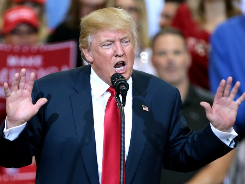 Donald Trump speaking with supporters at a campaign rally in Arizona.