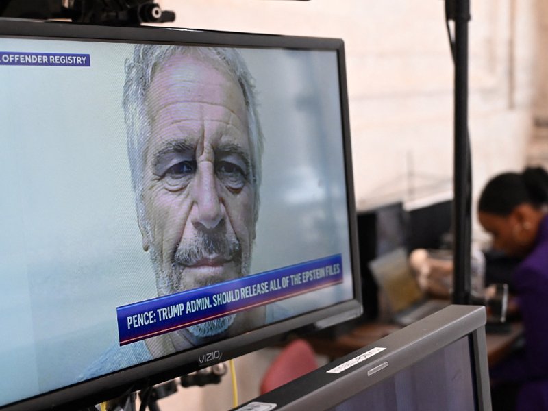 A mugshot of Jeffrey Epstein seen on a television in Washington DC in July 2025.