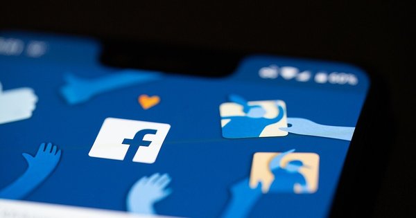 A phone displaying Facebook’s logo