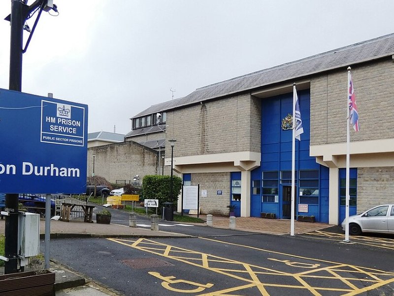 A sign outside a building reading “Welcome to HM Prison Durham”