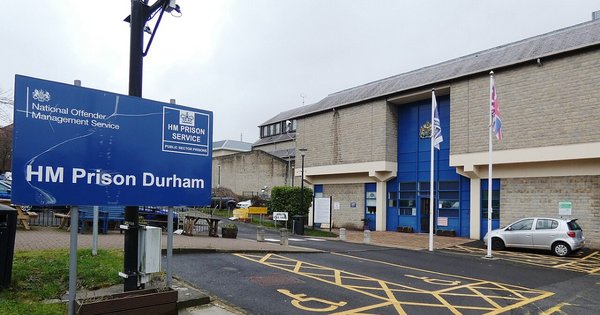A sign outside a building reading “Welcome to HM Prison Durham”