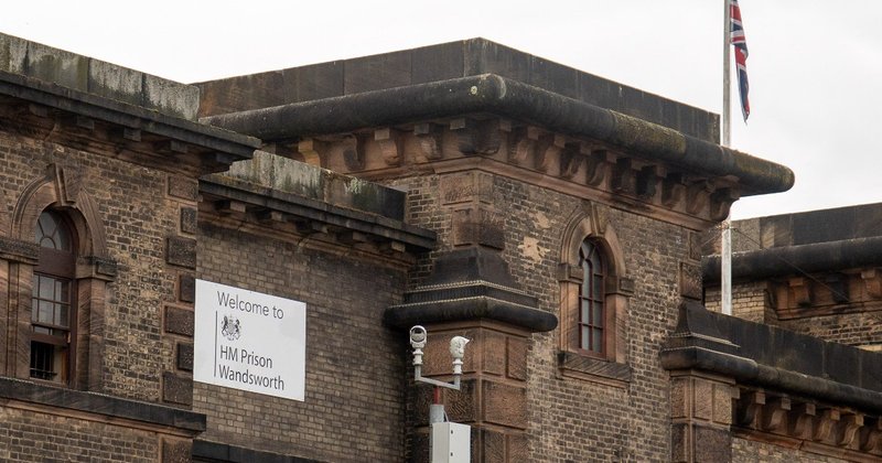 A sign on a building reading “Welcome to HM Prison Wandsworth”