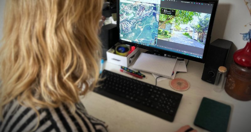 A photo of a fact checker working on a computer.