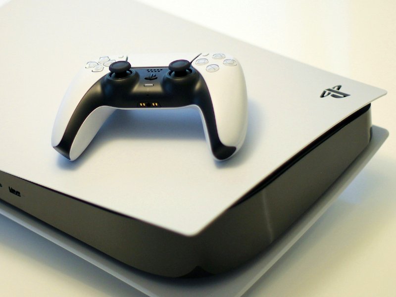 An image of a PlayStation 5 console and a controller.