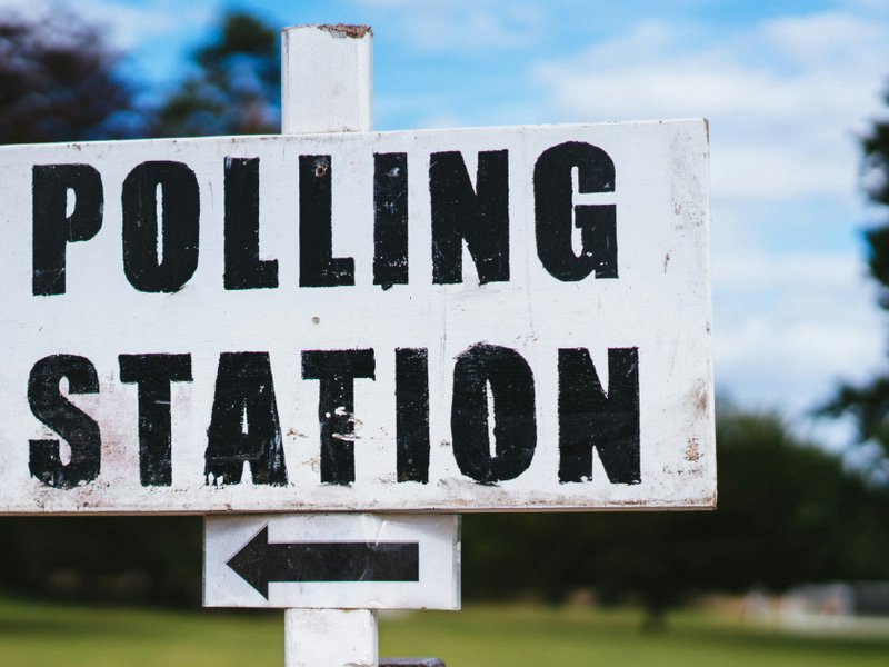 A polling station sign.