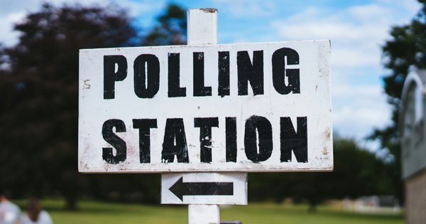A polling station sign.