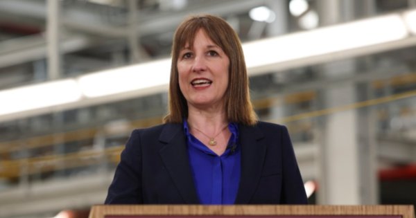 Rachel Reeves speaking at a podium at Jaguar Land Rover