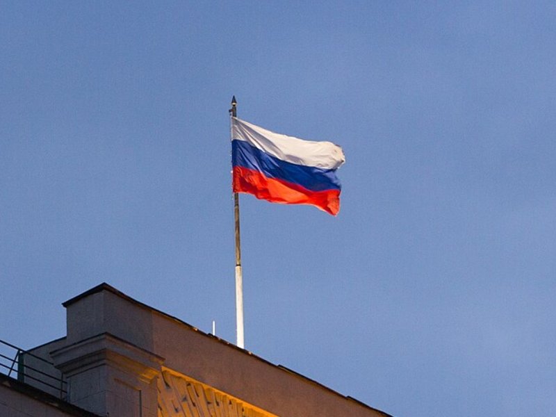 Russian flag flying over the Council of Labor and Defense building in Moscow, Russia.