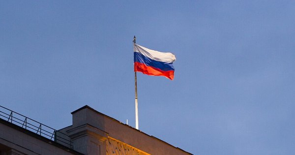 Russian flag flying over the Council of Labor and Defense building in Moscow, Russia.