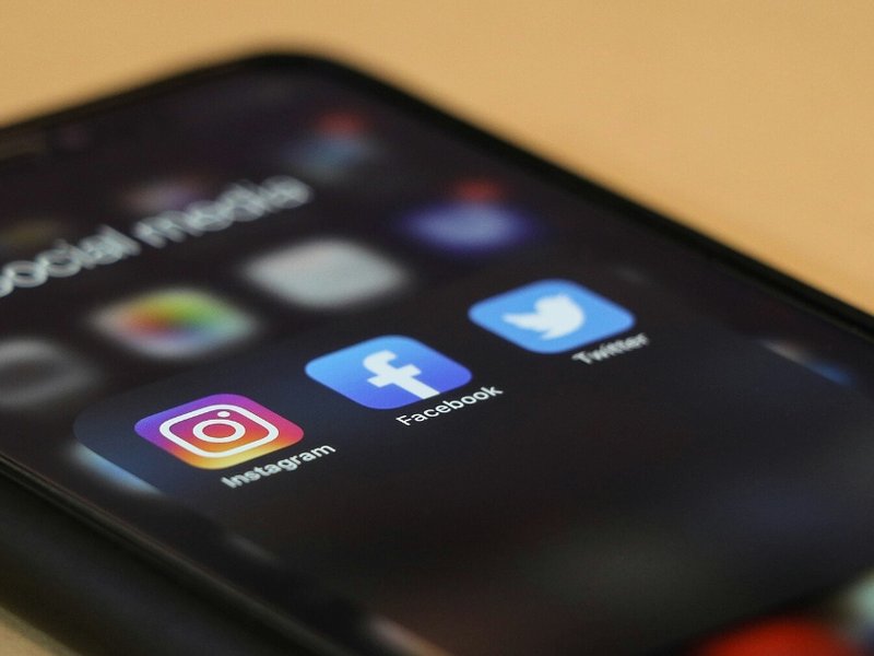 A phone screen with the icons for social media apps illuminated.