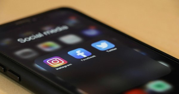 A phone screen with the icons for social media apps illuminated.