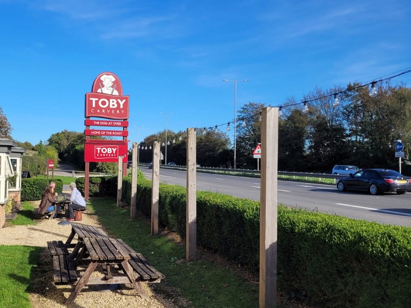 Outdoor seating at a Toby Carvery restaurant in Highnam.