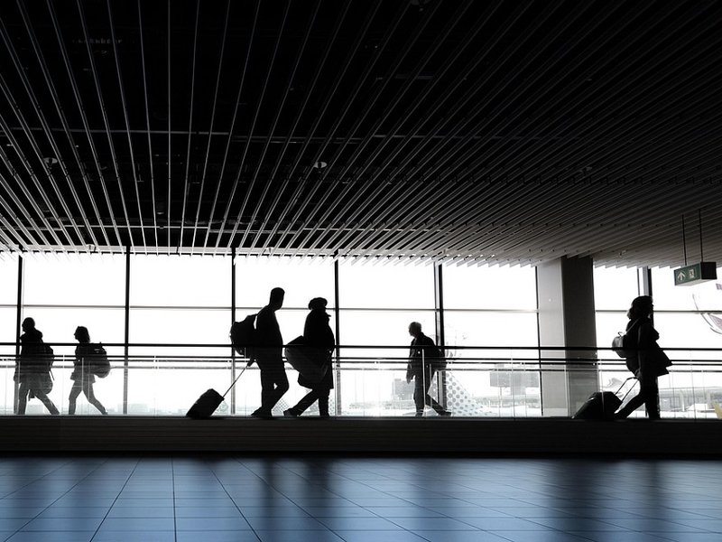 People travelling at an airport