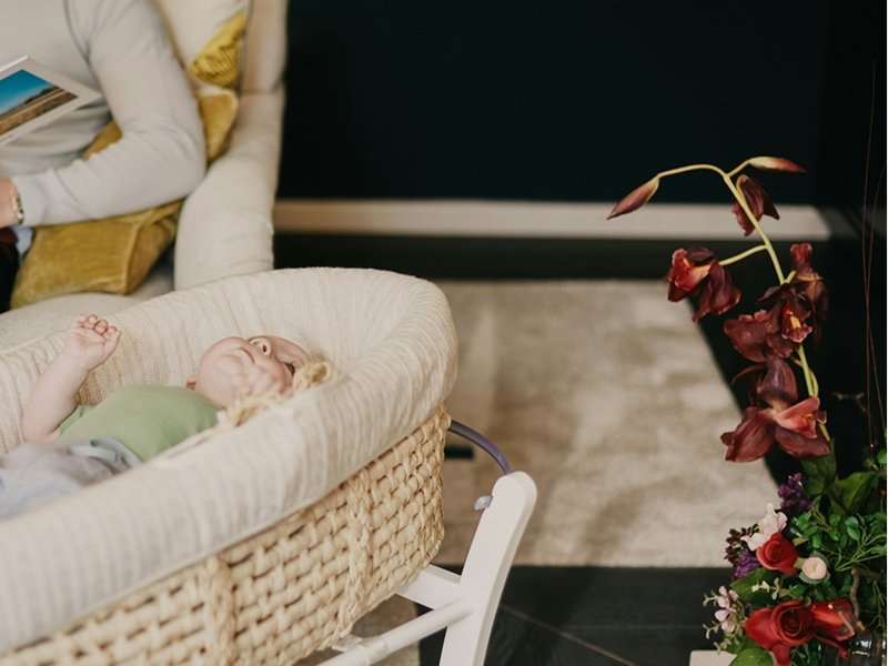 A baby in a wicker basket