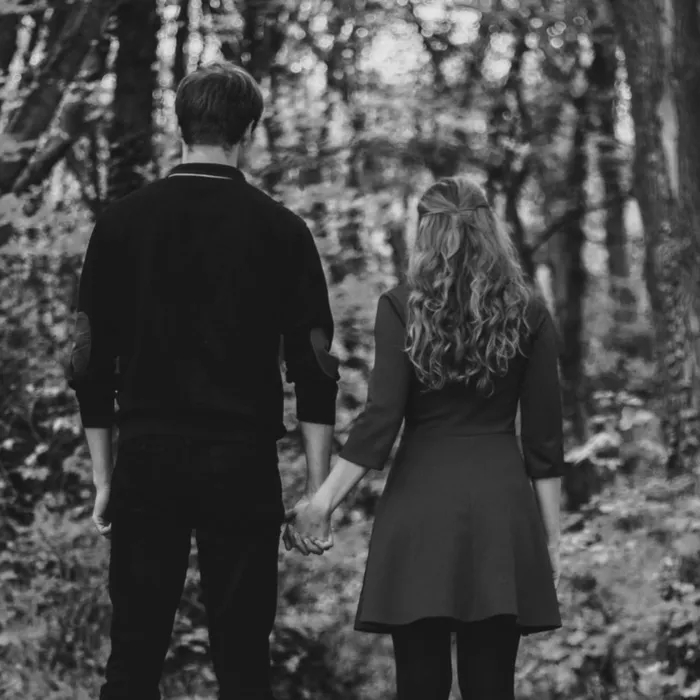 Man and woman holding hands