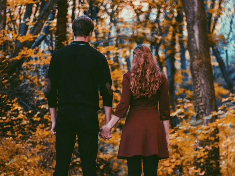 Man and woman holding hands