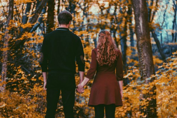Man and woman holding hands