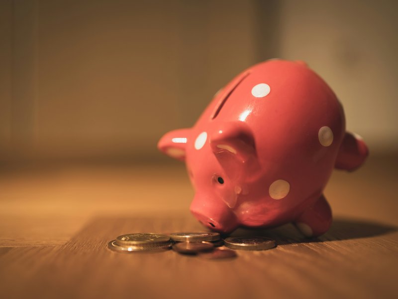 A photo of coins in a piggy bank