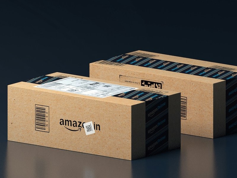 Two boxes with the Amazon logo on their sides