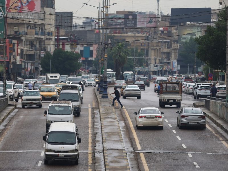 Vehicles driving on a road in Baghdad, Iraq