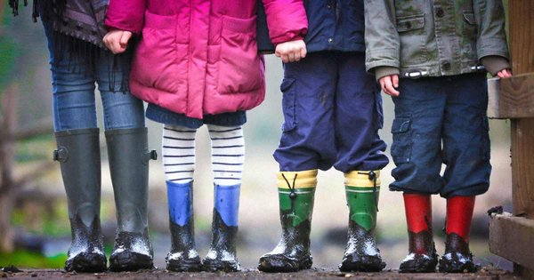 A photo of children playing in the mud.