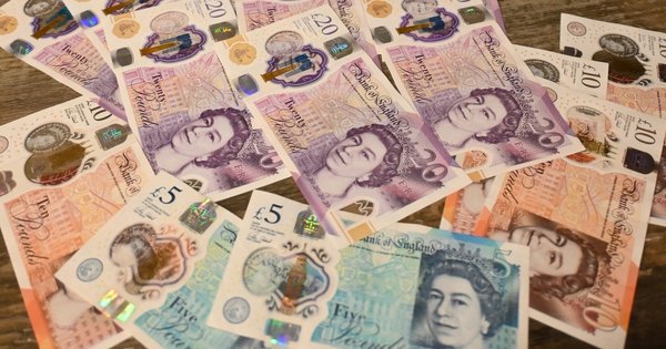 Cash notes strewn across a table