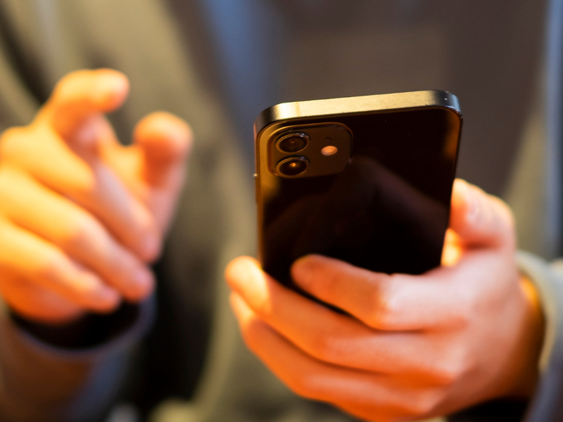A close up of a person using a mobile phone