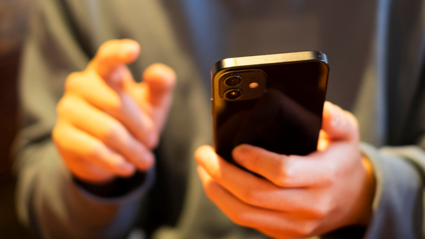 A close up of a person using a mobile phone