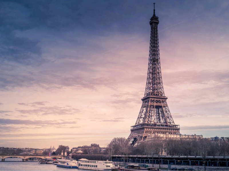An image of the Eiffel Tower by the River Seine, Paris