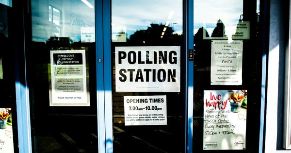 Door with the words “Polling Station” on it.